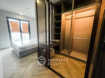 Spacious bedroom with walk-in closet and large windows for natural light