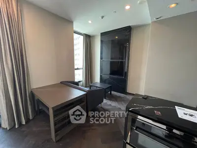 Modern living room with sleek furniture and large windows