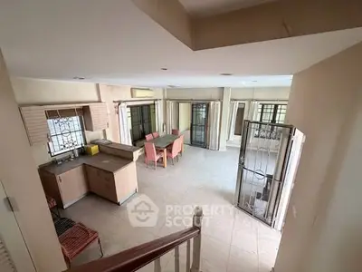 Spacious open-plan living area with dining space and natural light