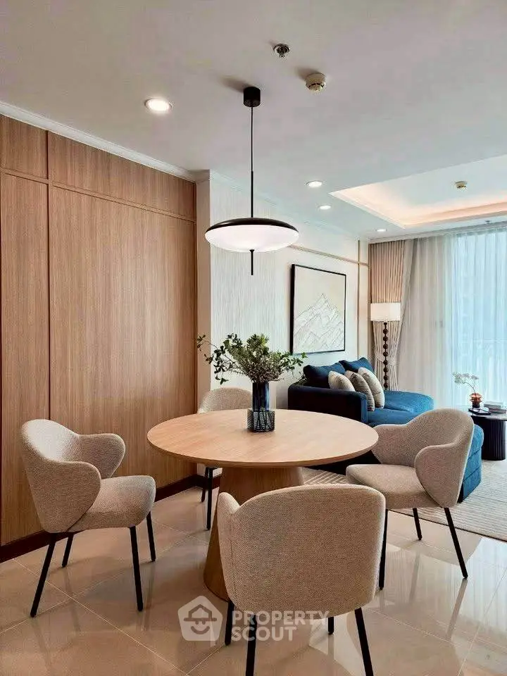 Modern living room with elegant dining area and stylish decor