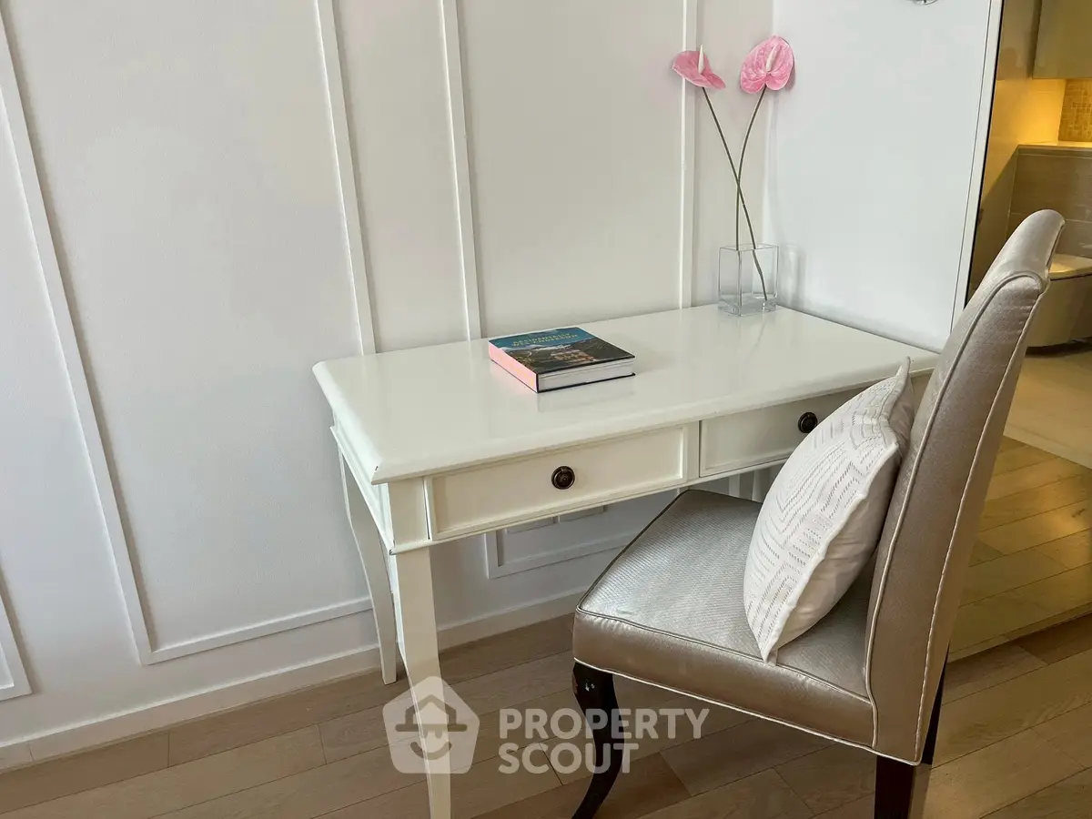 Elegant study nook with white desk and chair, perfect for home office setup.