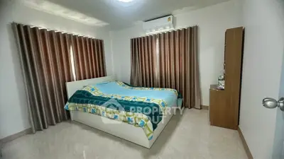 Cozy bedroom with modern decor and natural light