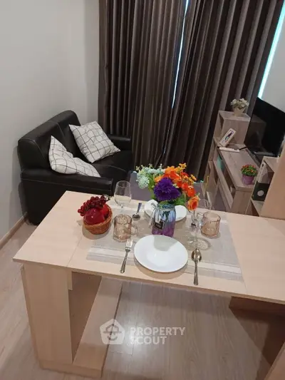Stylish living room with elegant dining setup and cozy seating area, perfect for modern living.