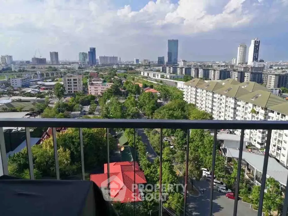 Stunning cityscape view from a high-rise balcony overlooking lush greenery and modern skyline.