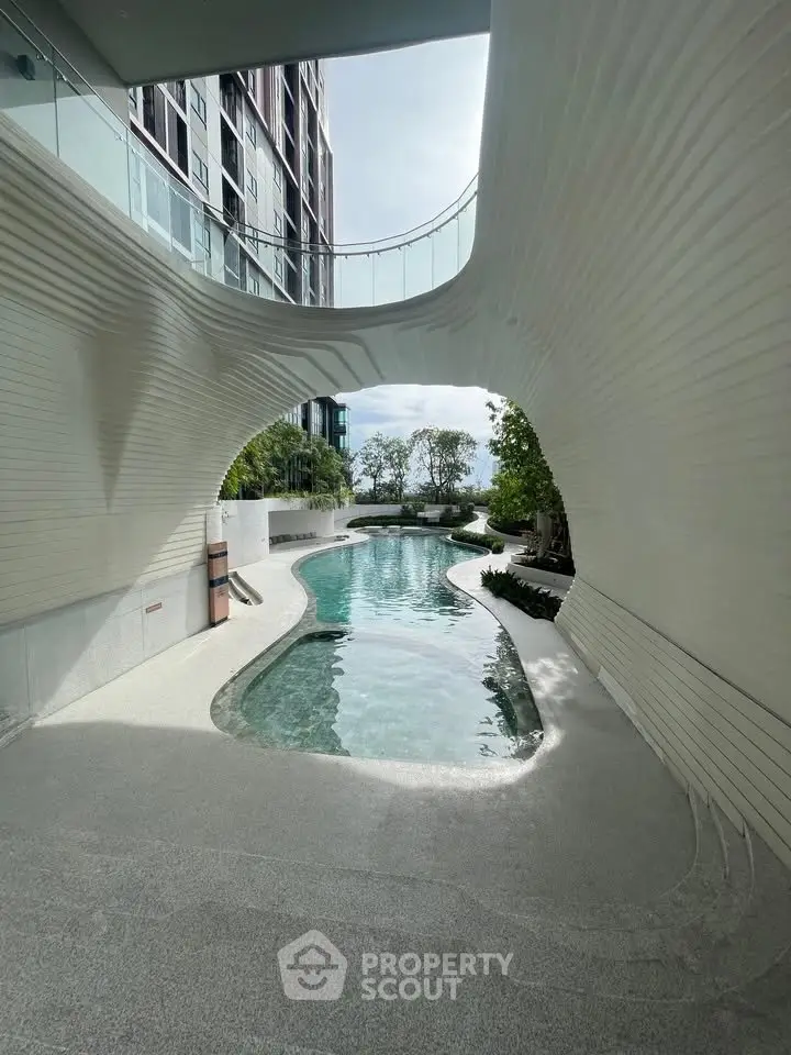 Luxurious modern pool area with unique architectural design and serene surroundings.