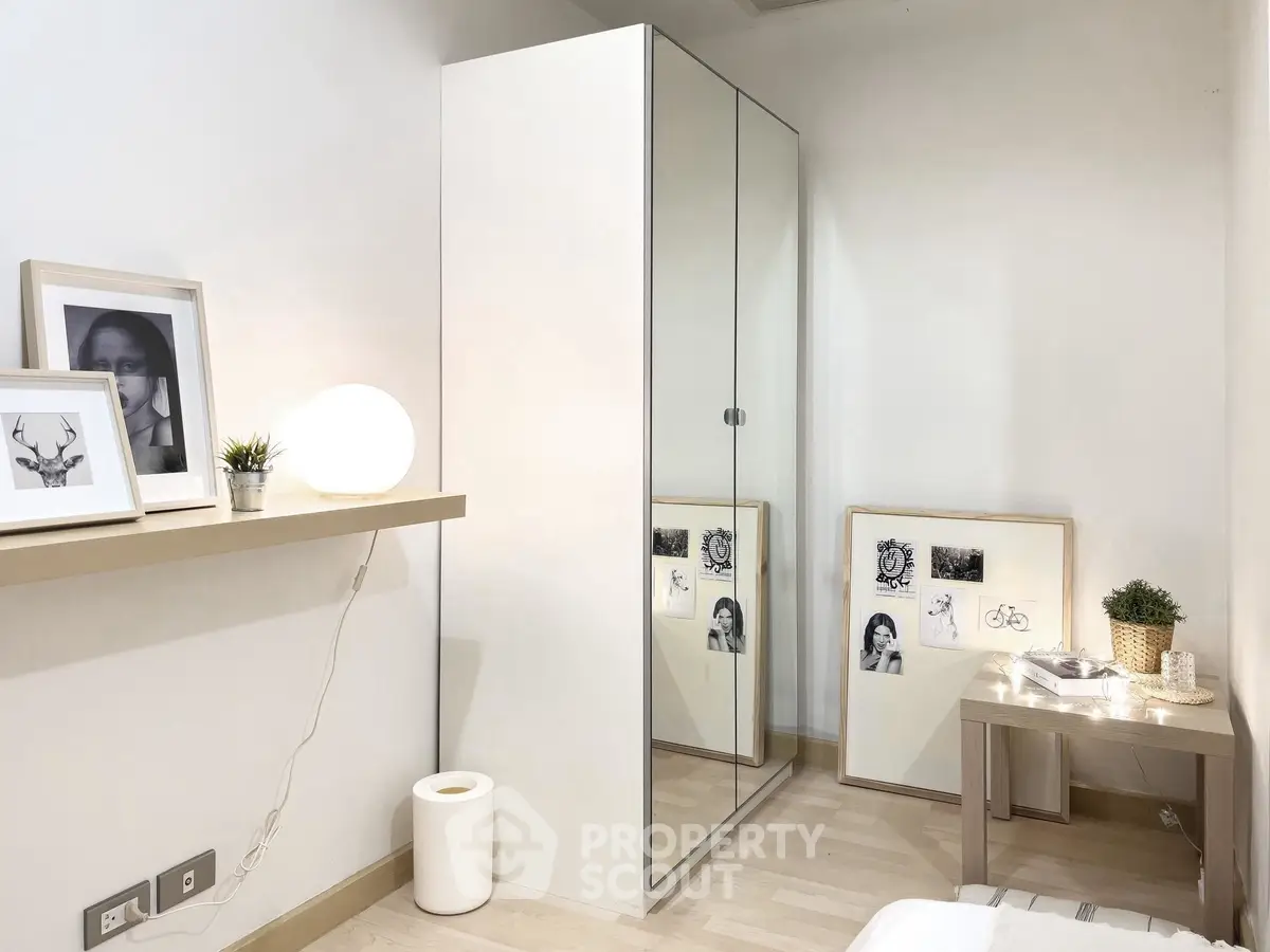Modern minimalist bedroom with mirrored wardrobe and stylish decor