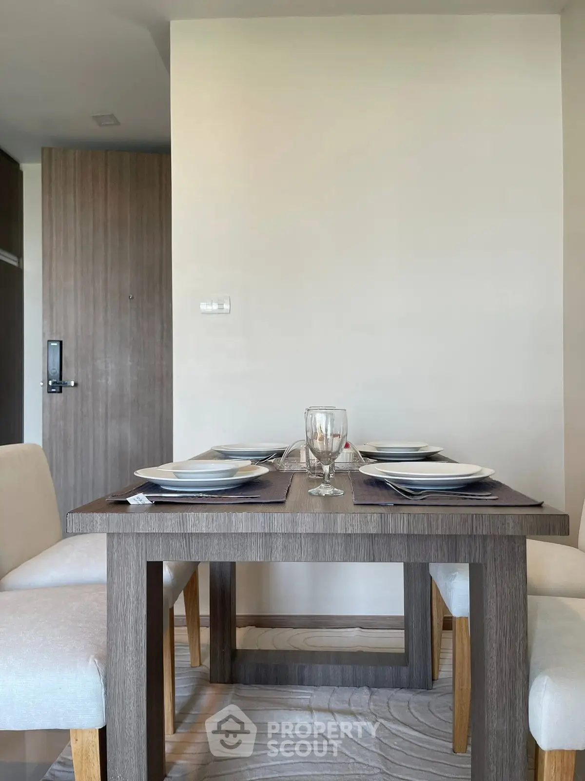 Modern dining area with elegant table setting in a stylish apartment