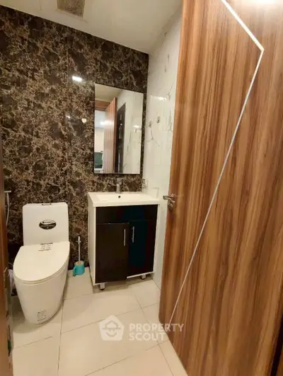 Modern bathroom with sleek design and wood accents