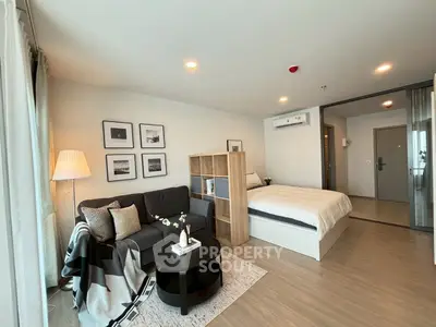 Modern studio apartment with cozy living area and stylish decor