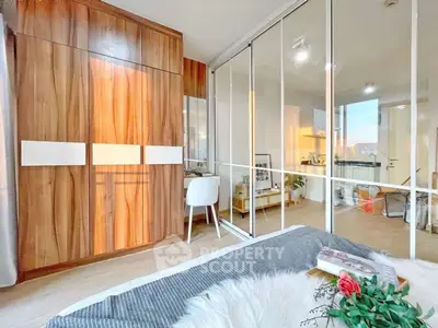 Modern bedroom with sliding glass doors and stylish wooden wardrobe