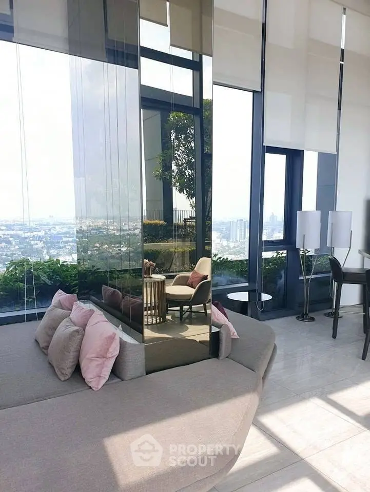 Luxurious high-rise living room with panoramic city views and elegant modern decor.