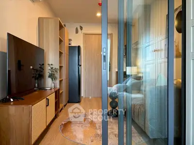 Modern living room with glass partition and stylish decor