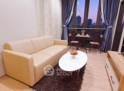 Chic living room with cozy sofa and city view balcony, perfect for relaxation.