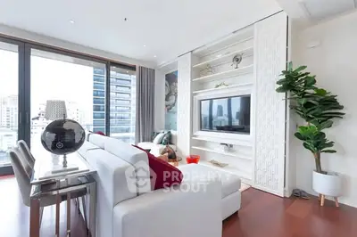 Luxurious modern living room with city view, elegant decor, and large windows for natural light.