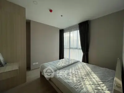 Modern bedroom with large window and elegant curtains, featuring a cozy double bed and minimalist design.