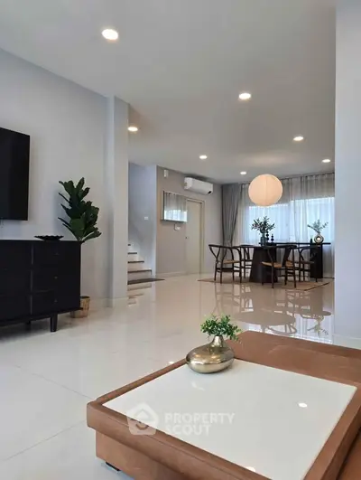 Spacious modern living room with elegant dining area and stylish decor