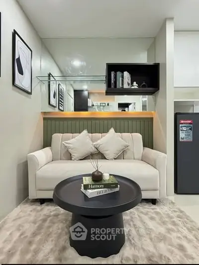 Modern living room with stylish decor and cozy seating area, perfect for relaxation and entertainment.