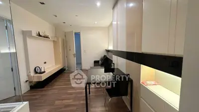 Modern living room with sleek furniture and wooden flooring, perfect for urban living.