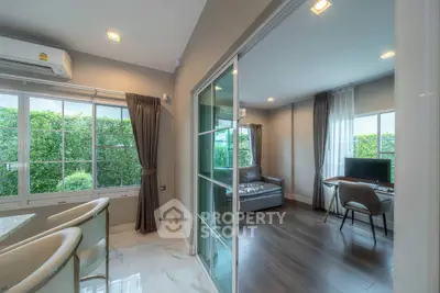 Modern living room with large windows and stylish decor