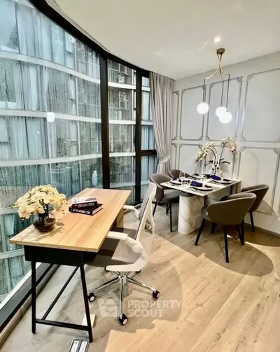 Modern study and dining area with large windows and elegant decor