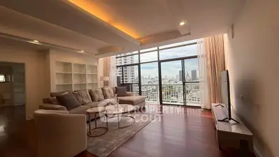 Spacious living room with stunning city view and modern furnishings