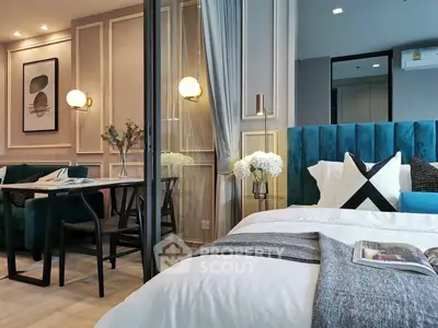 Luxurious modern bedroom with elegant decor and cozy seating area, perfect for stylish living.