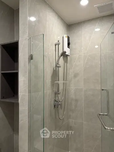 Modern bathroom with sleek glass shower and elegant tile design