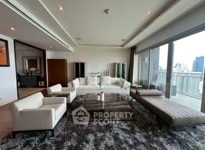 Luxurious modern living room with panoramic city view and elegant furnishings.
