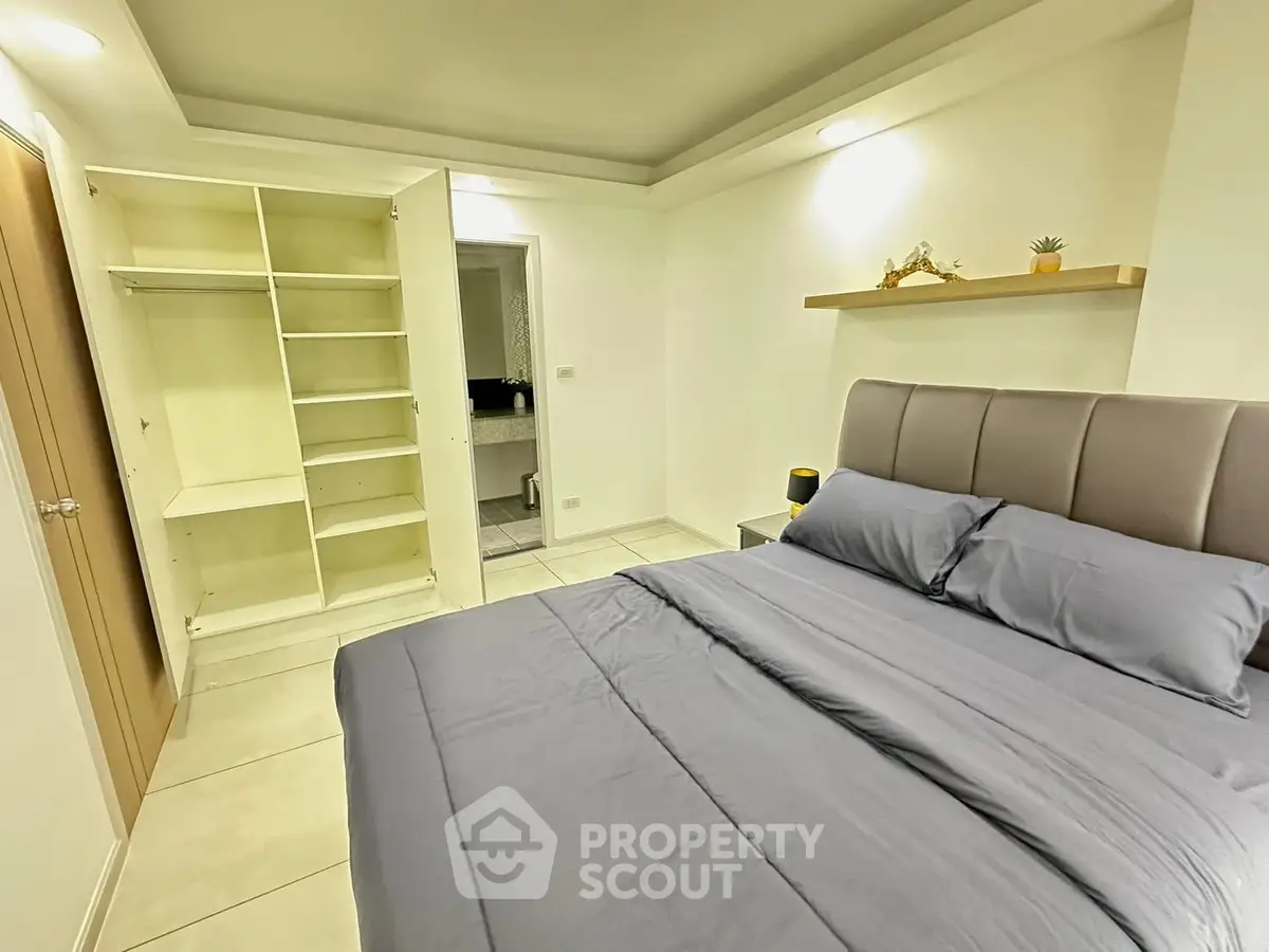 Spacious bedroom with modern design and ample closet space