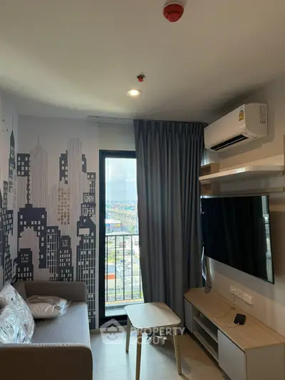 Modern living room with city view, featuring sleek furniture and wall art, perfect for urban living.