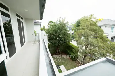Spacious balcony with garden view in modern residential area
