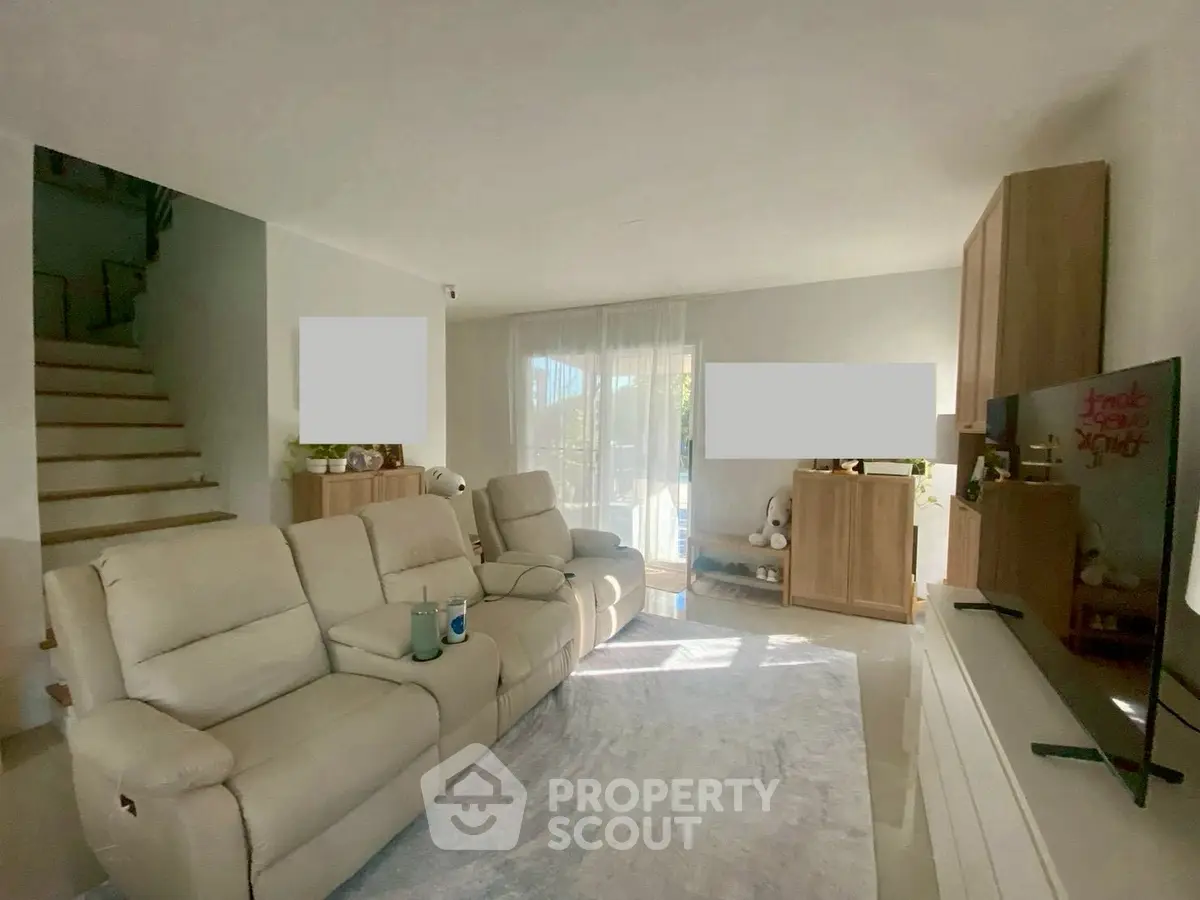 Spacious living room with modern furniture and natural light