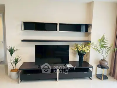 Modern living room with sleek TV stand and decorative plants