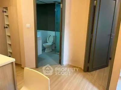 Modern apartment interior with bathroom and wooden flooring