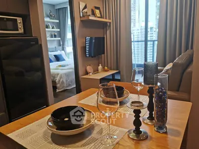 Modern open-plan living room with dining area and city view