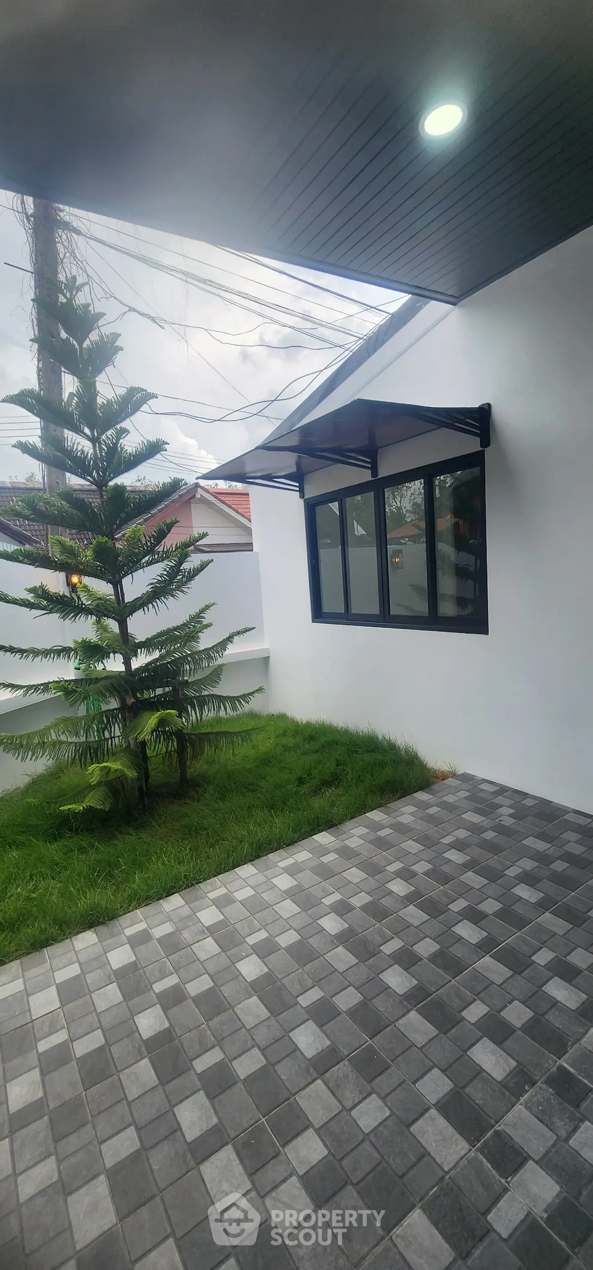 Modern exterior with sleek design and lush greenery, perfect for contemporary living.