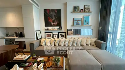 Modern living room with stylish decor and large sofa in a high-rise apartment