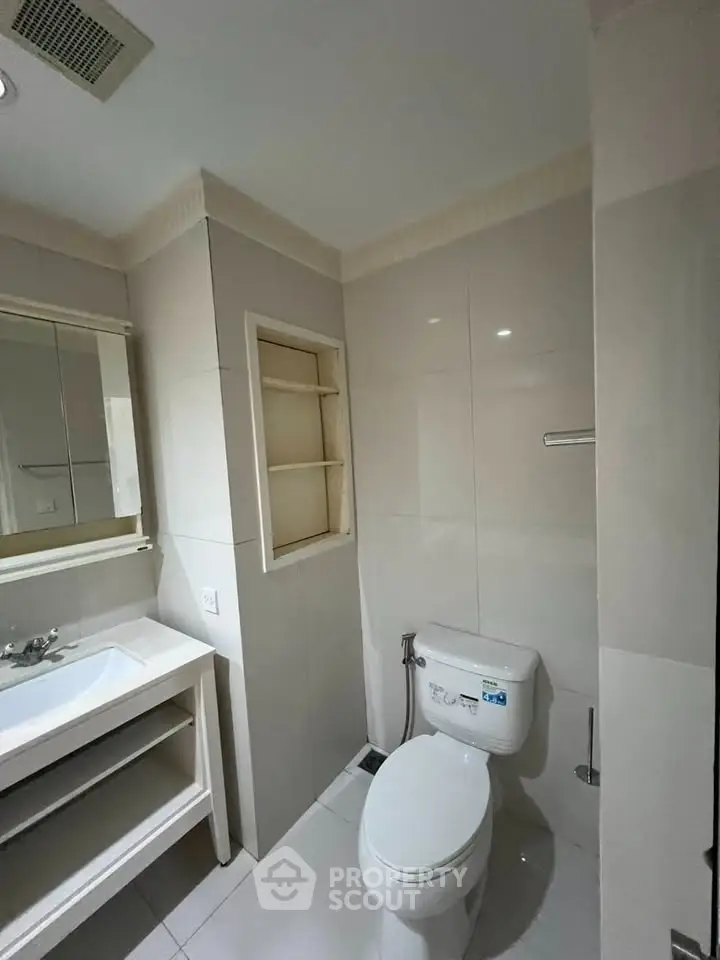 Modern bathroom with sleek fixtures and ample storage space