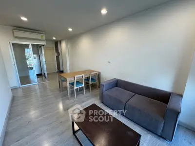 Spacious living room with modern furniture and open layout