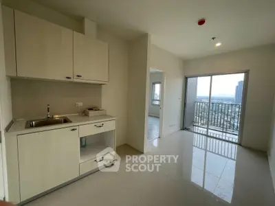 Modern apartment with open kitchen and balcony offering city views