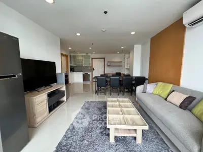 Spacious modern living room with open kitchen and stylish decor