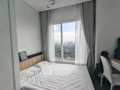 Cozy bedroom with stunning city view and natural light