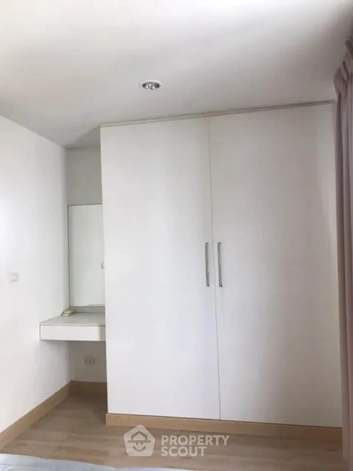 Modern bedroom with built-in wardrobe and minimalist design