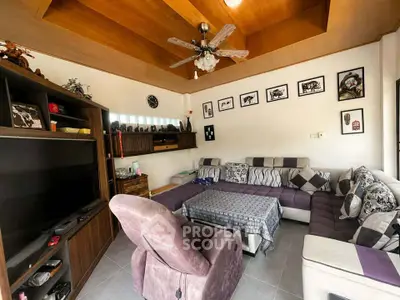 Cozy living room with modern decor and ample seating, perfect for relaxation and entertainment.