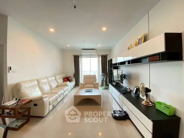 Spacious modern living room with sleek furniture and natural light