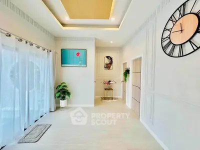 Elegant living room with modern decor and large wall clock