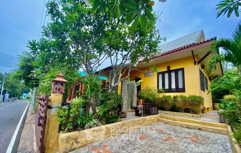 Charming single-story home with lush garden and traditional architecture, perfect for serene living.