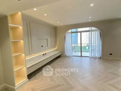 Spacious modern living room with elegant flooring and large windows offering city views.