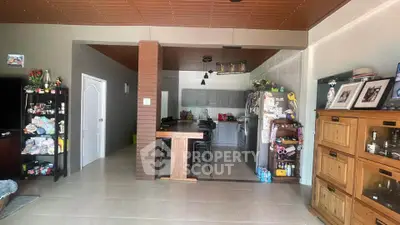 Spacious open-layout kitchen with modern appliances and ample storage in a cozy home setting.