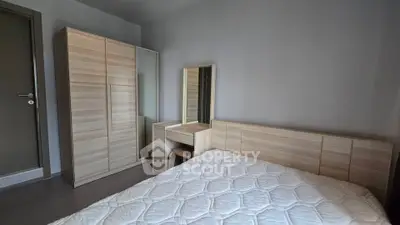 Modern bedroom with wooden furniture and comfortable mattress